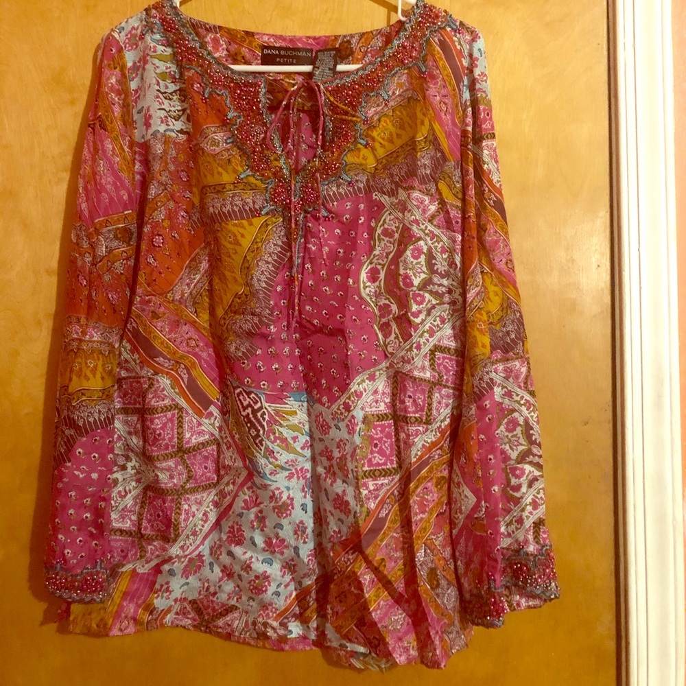 A  multi color blouse long sleeves.